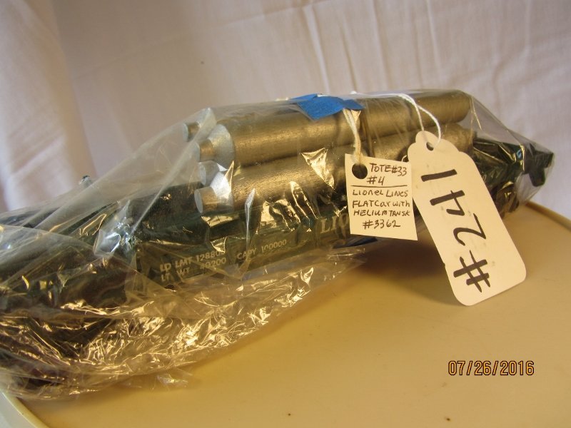 Lionel: Description: Lionel Flat Car w/Helium Tans or logos Scale: O Scale Engine Number: 3362 Catergory: Toy Train Note: All Items Selling AS-IS. All Sales are Final. Bid Your Judgement