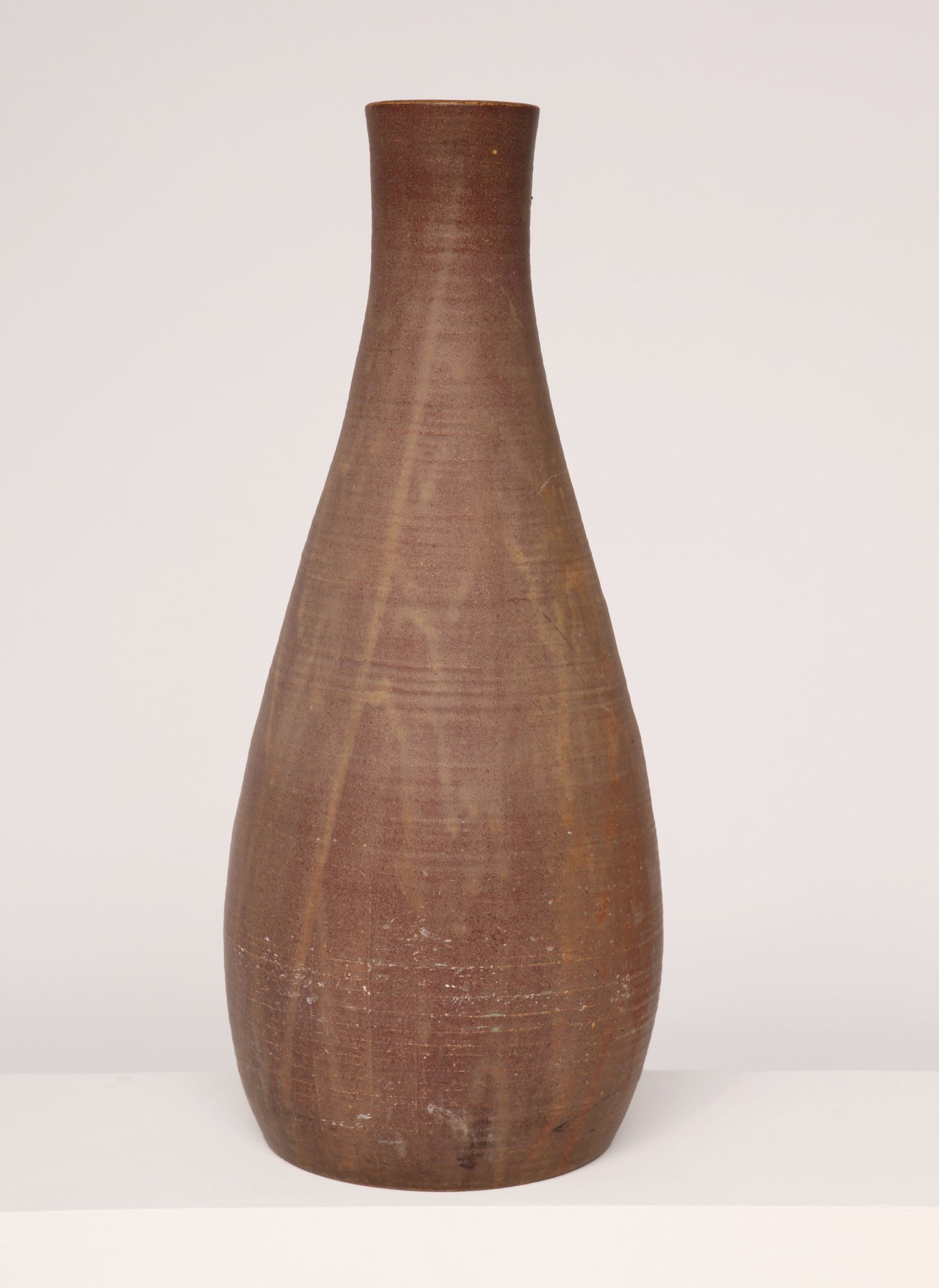 Accolay, High Vase, c. 1960: Accolay High Vase, c. 1960. This high vase by Accolay, created around 1960, is a striking example of mid-century ceramic design. Crafted in ceramic, the vase features a tall, elegant silhouette with a