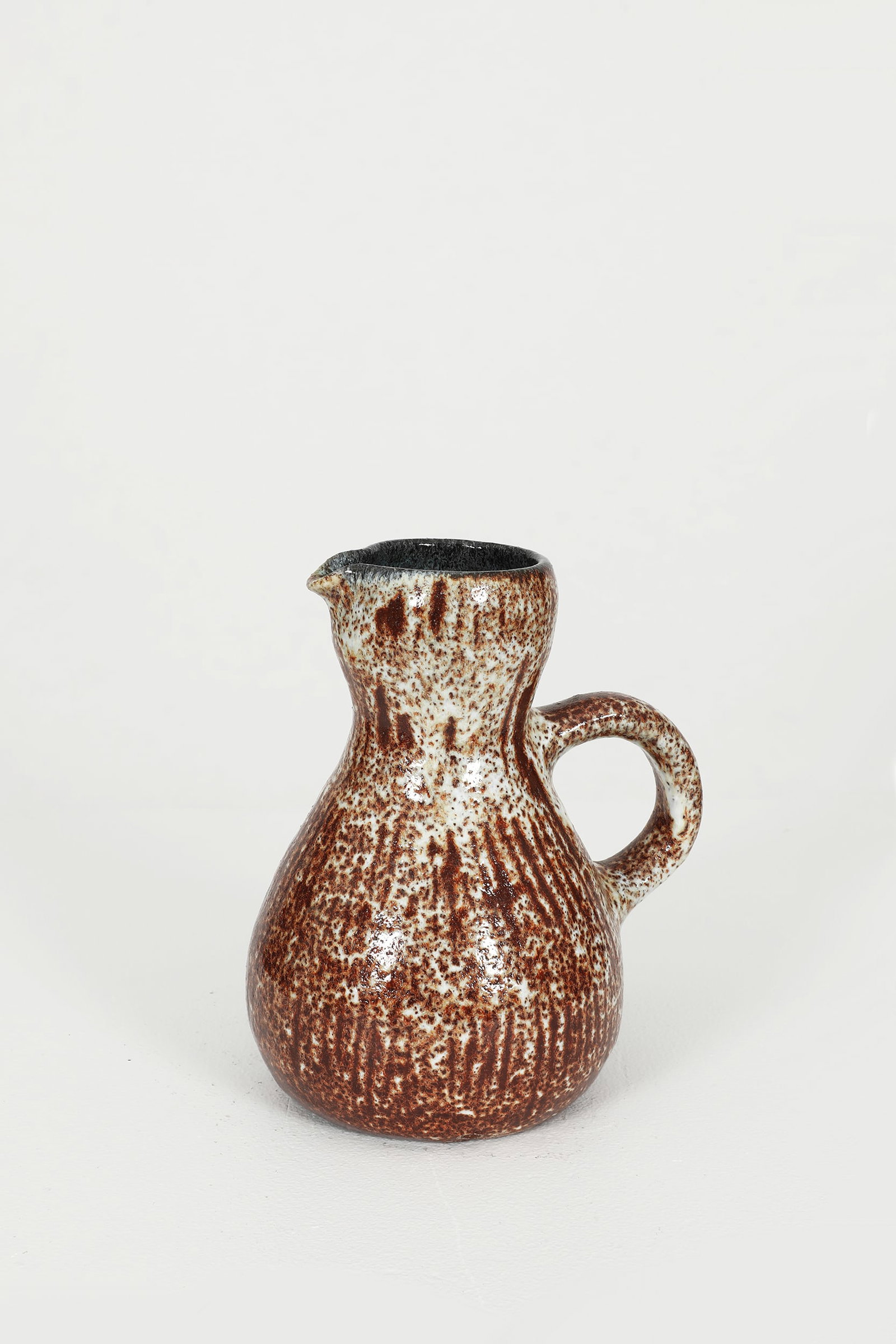Accolay, Pitcher, c.1960: Accolay Pitcher, c.1960. This vintage ceramic pitcher by Accolay, crafted circa 1960, showcases the distinctive craftsmanship and artistic flair of the renowned French ceramics collective. With its or