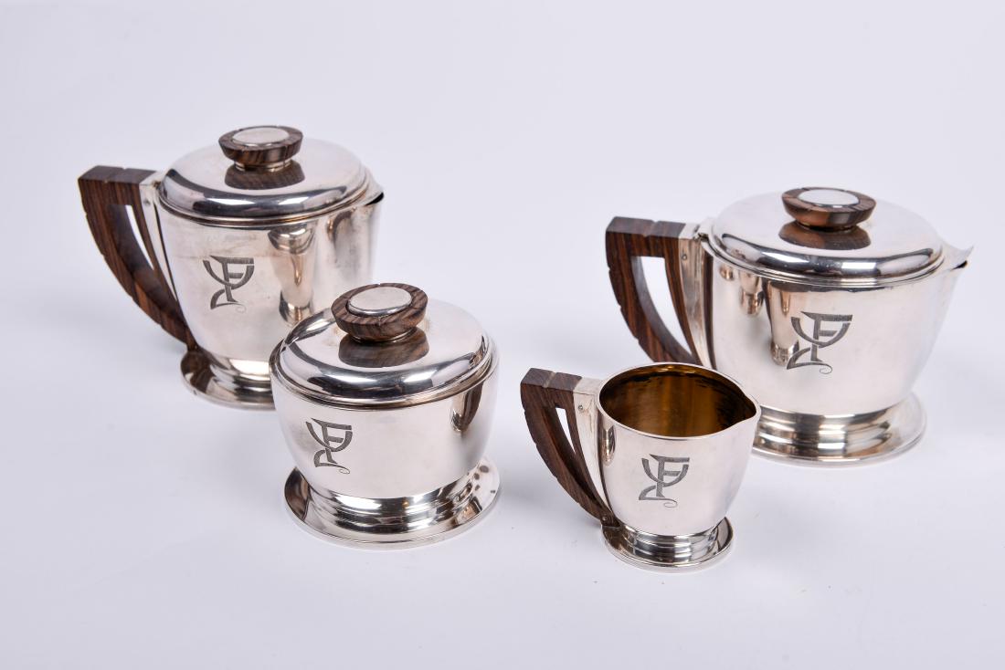 Jean Puiforcat Sterling Silver Tea Set: Sterling and rosewood Jean Puiforcat French Early 20th Century Pitchers: 3.5 x 6 x 4 Sugar: 3 x 3.5 x 3.5 Cream: 2 x 3.25 x 3.25