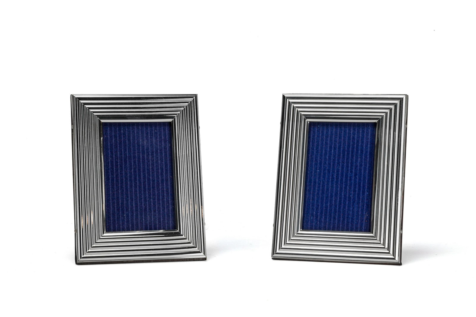 Pair of Sterling Silver Picture Frames: A pair of fluted sterling silver picture frames. American 1970s.
