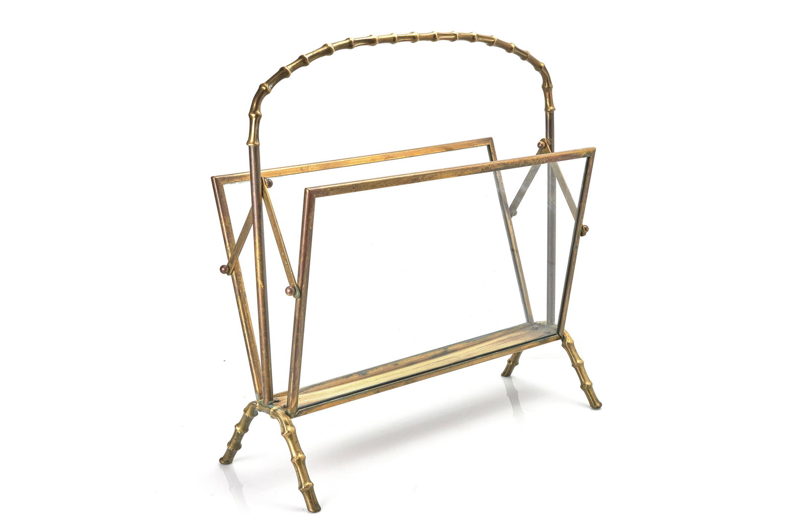 Maison Bagues Magazine Rack: A brass and glass magazine rack by Maison BaguesFrench, 1940s