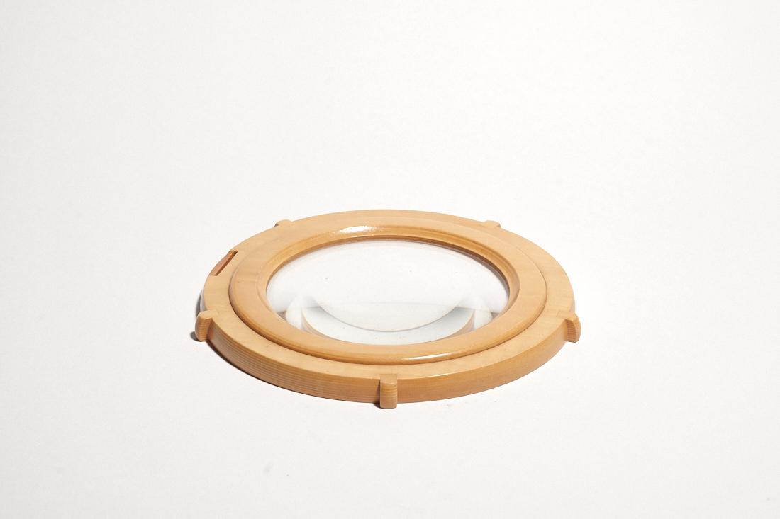 Hermes Pearwood Magnifier: A fine Hermes magnifier in pearwood. Marked on back. In the form of a porthole. 5.5" Diameter.