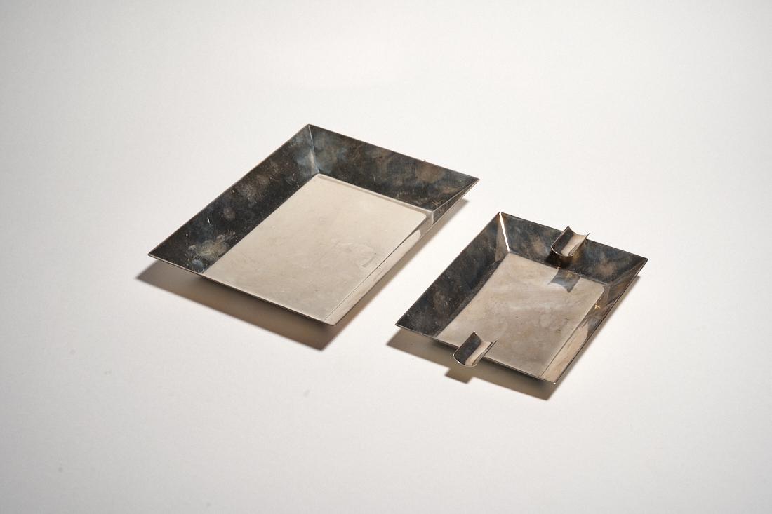 Christofle Ashtray & Catchall: A fine set by Christofle consisting of an ashtray and catchall, both marked.Ashtray: 6.5" x 4.5" x 3.25"Catchall: 7.75" x 5.75" x 1"