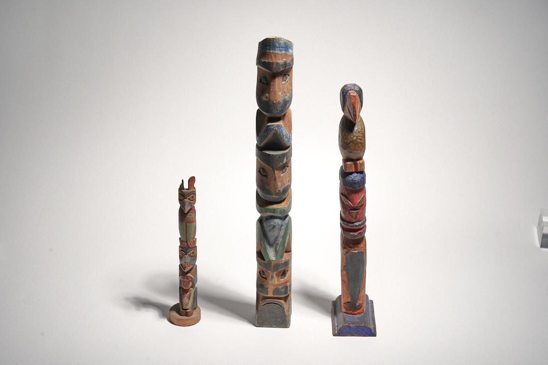 Group of 3 Carved Totems: A group of carved and painted totems. Early 20th century, Northwest coast. Original polychrome paint. Tall: 18" x 2" x 2"Medium: 14" x 2.5" x 3.5"Small: 9.5" x 2" x 2"