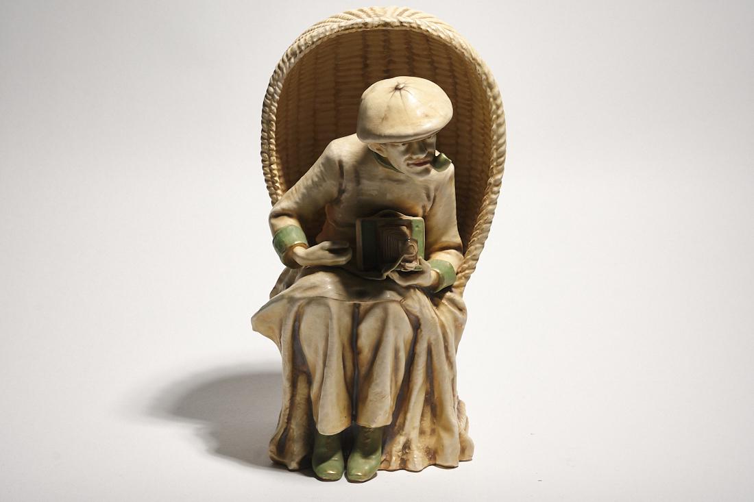 Amphora Kodak: An austrian ceramic sculpture of a man with kodak camera, by Amphora. 1920s 12" x 8" x 7"
