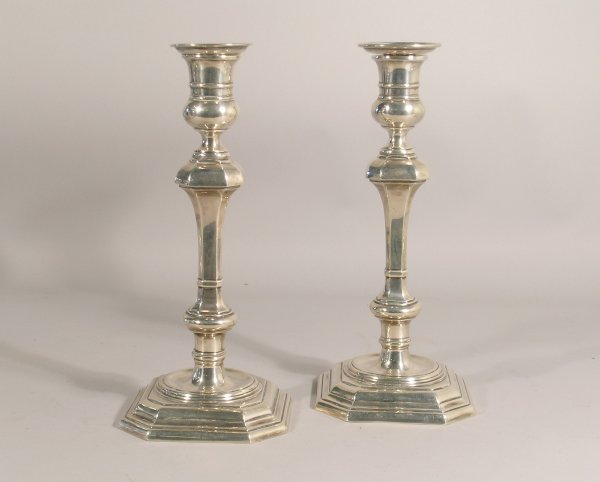A near pair of 18th century style candlesticks, by