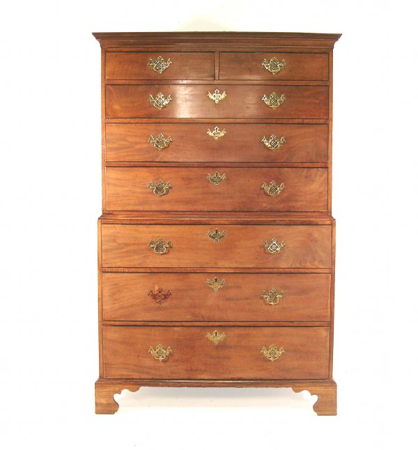A George III chest on chest, circa 1800, mahogany: A George III chest on chest, circa 1800, mahogany, the moulded cornice over two short and six long graduated drawers, fitted with later brass handles in the manner of Chippendale, raised on shaped bra
