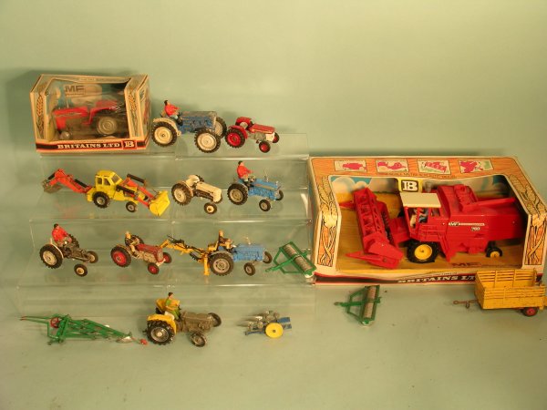 A group mainly unboxed of tractors in play worn co
