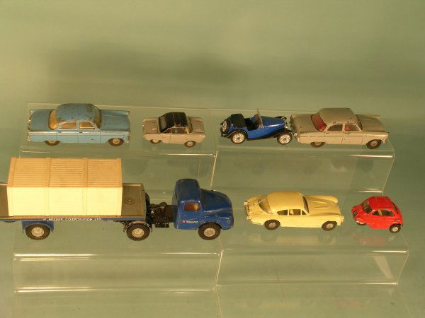 Seven Spot On vehicles (unboxed) to include two F: Seven Spot On vehicles (unboxed) to include two Ford Zodiacs, one Isetta bubble car, an MG PB midget in blue, a Friskysport in grey and black, a Jenson 541 and an Austin low loader with plastic crate