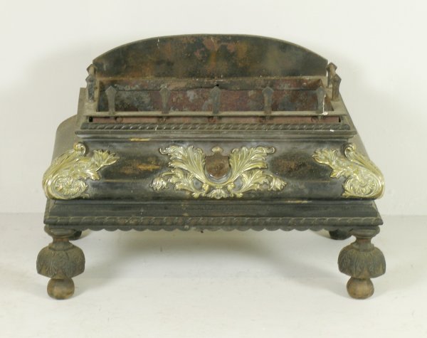 A William IV fire basket, iron with cast brass mo