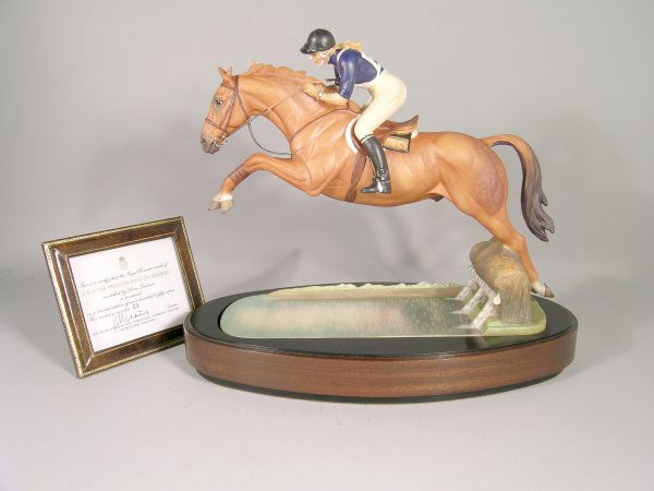 A Royal Worcester model of HRH The Princess Anne o: A Royal Worcester model of HRH The Princess Anne on Doublet modelled by Doris Lindner, limited edition number model No.53 of 750, circa 1972, printed black mark, height 31cm, raised on wooden stand, b