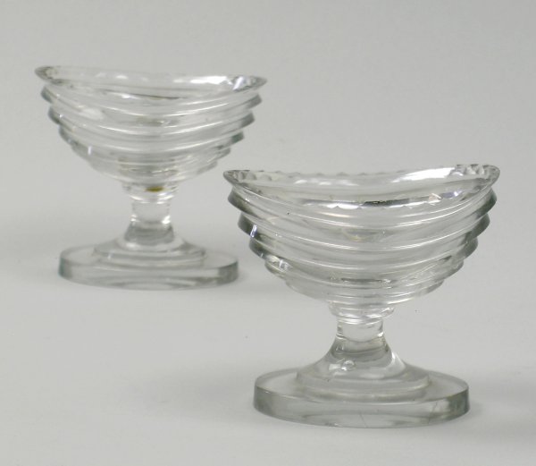 A pair of slice cut navette shape pedestal glass s