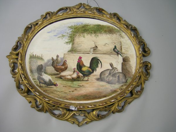 A pair of oval Continental pottery plaques, 19th c