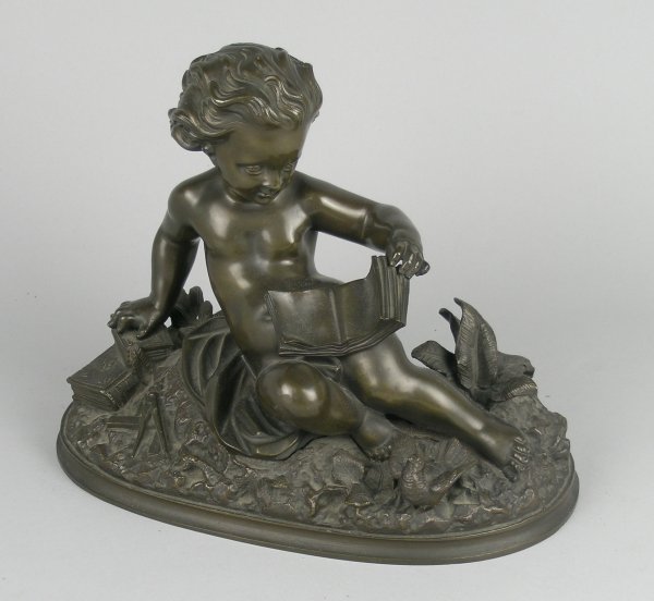 A patinated bronze figure of a seated putti symbol
