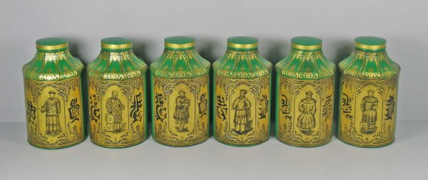A set of six green and gilt dec tole canisters