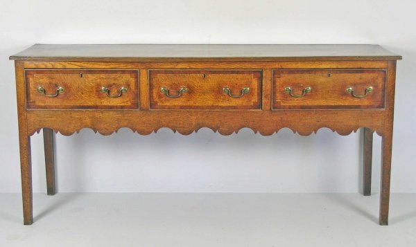 A George III three drawer dresser base, West Midl