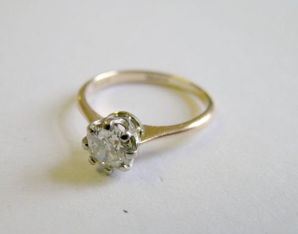 A solitaire diamond ring, the old brilliant cut d