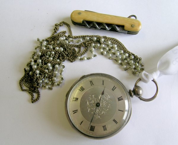 A lady's 'Fine Silver' open faced decorative fob