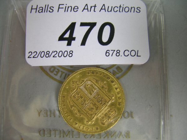 A Victorian gold shield back half sovereign dated