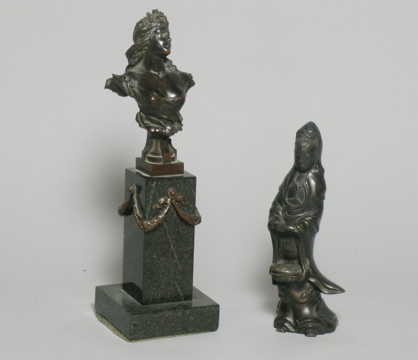 A small bronze bust of a young woman after the an