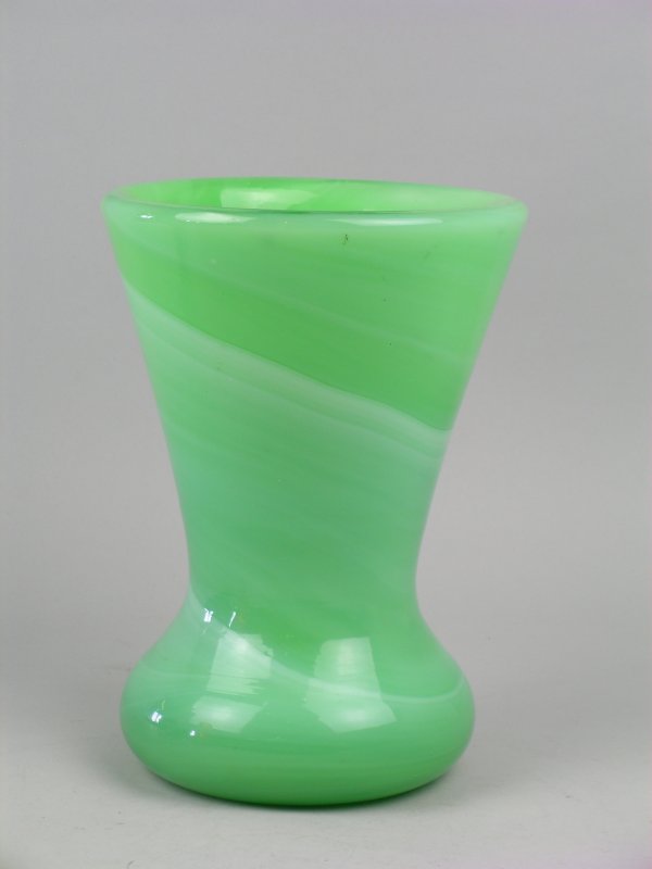 A Nazeing type green glass vase, the ovoid base w