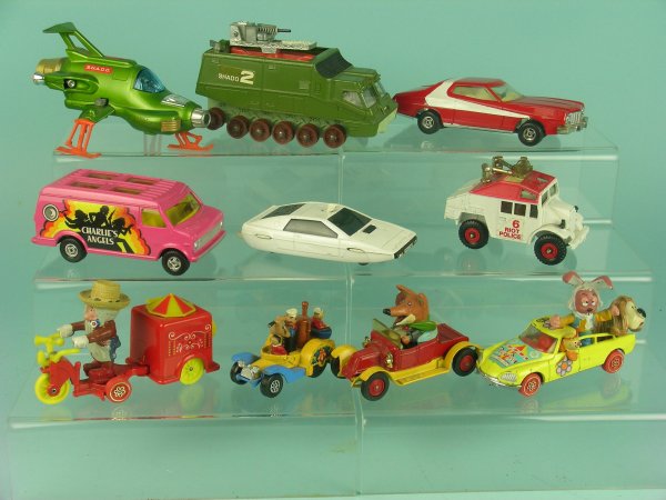 A group of ten unboxed character toy vehicles, ite