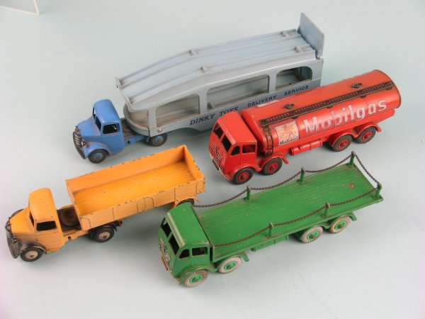 A group of four Dinky Toys commercial vehicles (un