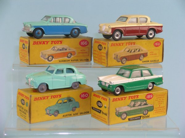 A group of four boxed Dinky Toy Saloon cars to inc