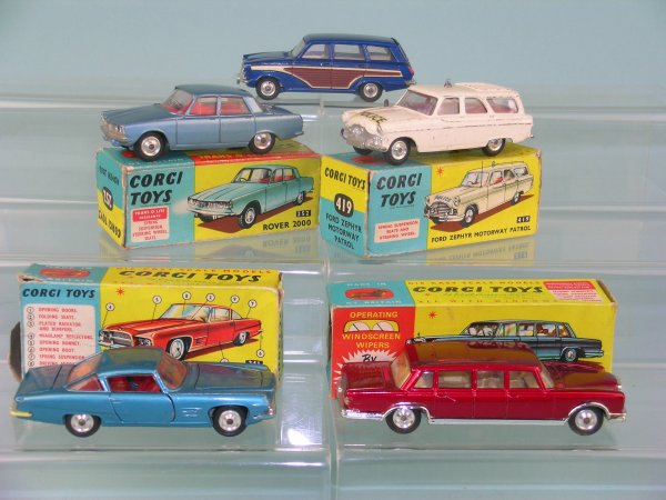 A group of five boxed Corgi toys Saloon cars, mode