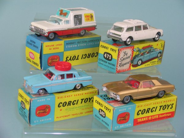 A group of four boxed Corgi toy cars, the first a