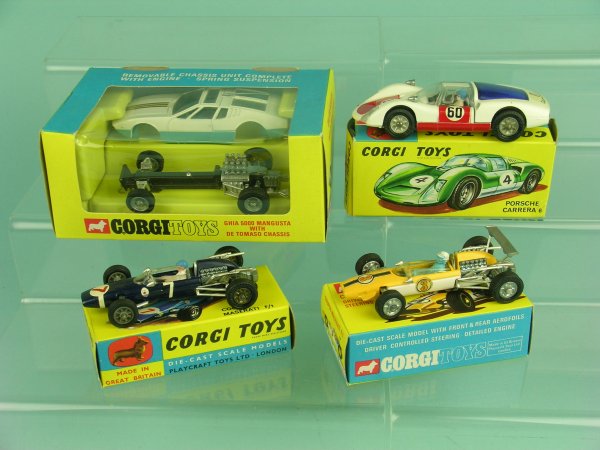 A group of four boxed Dinky racing cars to include