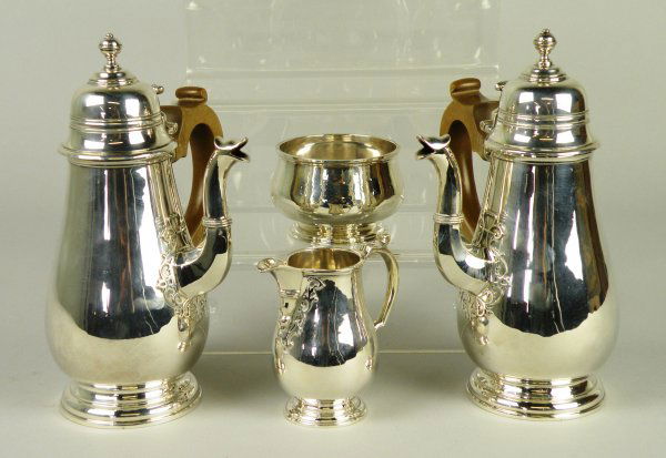 A silver four piece bachelor's coffee service, Ri: A silver four piece bachelor's coffee service, Richard Comyns, London 1931, in George I style, each piece of baluster, pedestal form, with fretwork detail, comprising; a side pouring coffee pot and ho