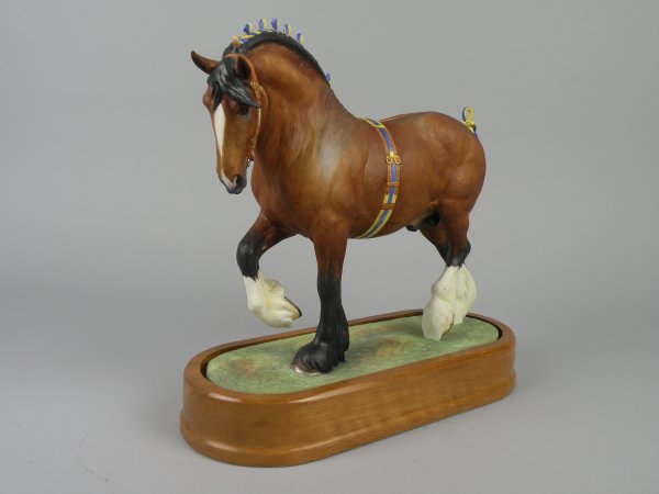 A Royal Worcester model of a Shire Stallion 'Mano: A Royal Worcester model of a Shire Stallion 'Manor Premier King' by Doris Lindner, number 246 of 500, issued 1963, in the Heavy Horses series, 26.5cm high, on wooden plinth base, with certificate (a/f