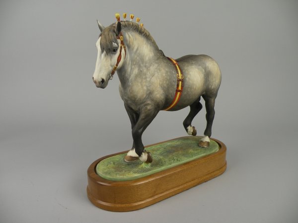 A Royal Worcester model of a Percheron Stallion ': A Royal Worcester model of a Percheron Stallion 'Saltmarsh Silver Crest' by Doris Lindner, number 133 of 500, issued 1965, in the Heavy Horses series, 25.5cm high, on wooden plinth base, with certific