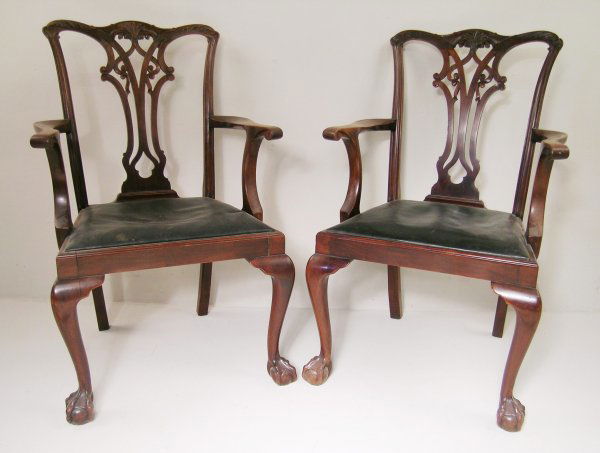 A Waring and Gillow dining room suite in the manne: A Waring and Gillow dining room suite in the manner of Chippendale, circa 1910-1920, the extending table with gadrooned edge and additional leaves on four cabriole legs terminating in the ball and cla