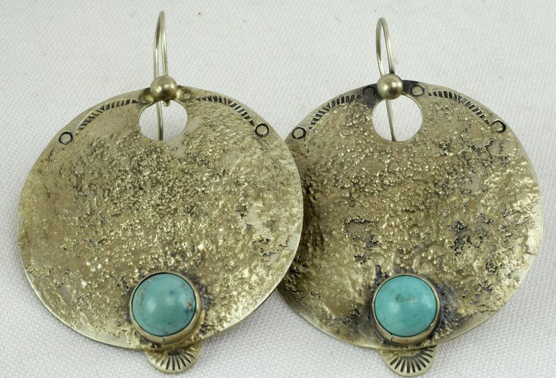 Native American Old Pawn Sand Cast Earrings: Measures 2.5 inches from hook to bottom and done in Sand Cast. These earrings are Sterling Silver and have a Turquoise Stone at the bottom. The round drop measures 1.75 x 2 inches. Unsigned- Native Am