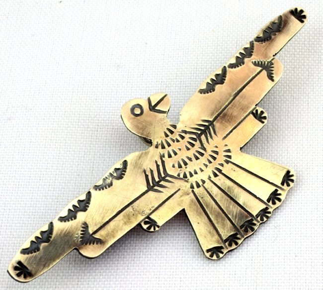 Native American Sterling Thunderbird Pin/Pendant: Measuring 3.25 inches wide and 1 3/8 inches tall this is a stamped Pin/Pendant in the Thunderbird. It is marked Sterling on the back and Signed "Yazzie". Has loop for chain or beads. Weighs 10 Grams.