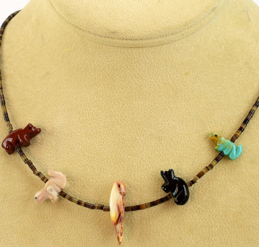 Navajo Heishi Bead & Multi-Stone Fetish Choker: A Fetish Heishi and Multi Stone Fetish Choker measures 19 inches in length. All Natural Stones hand carved with sterling closure.