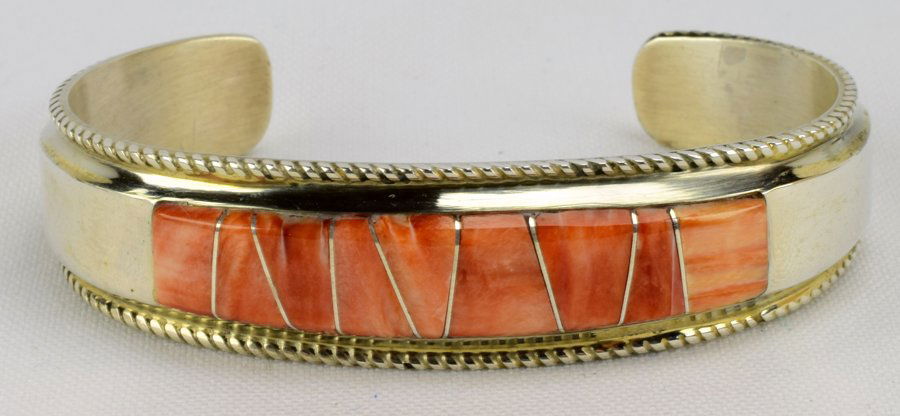 Native American Spiny Oyster Sterling Inlay Bracelet: Measures 3/4 inch wide with Inlay of Spiny Oyster across the top and a rope frame. Inside measures 5.25 with a gap of 1.25 inches. Marked Sterling and Hallmarked "M". Weighs 31.7 Grams. Native America