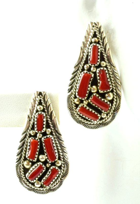 Navajo Sterling Cluster Coral Nugget Earrings: For pierced ears these measure 1.75 inches in length and have Natural Coral Nuggets in the center with a rope and notched frame. They are marked Sterling and Hallmarked "MH". Weigh 13.9 Grams. Native