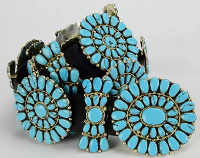 Sterling and Turquoise Statement Concho Belt: Measures 54 inches from the end of the Buckle to the tip end of the leather. this belt has a Buckle that Measures 2.75 inches wide x 2.5 inches Tall. It has 35 Turquise {Block} Stone in the Buckle. Th