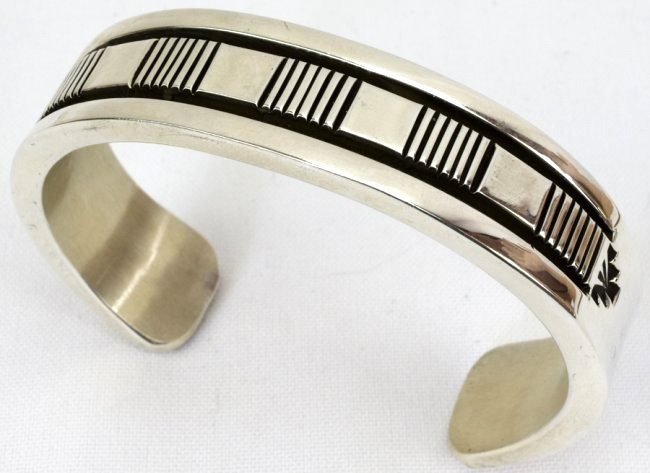 Bruce Morgan Heavy Sterling Men's Bracelet: Measures 3/4 inch wide and is approximately 1/8 thick. This bracelet has deep grooved stamped pieces across the top. The inside measures 6 inches plus a gap of 1.75 inches. Will fit a 7.75 inch or lit