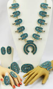 Masterpiece Squash Blossom Turquoise Neck. 7 Pc. Set: Sterling Silver Genuine Turquoise Vintage Needle Point Masterpiece Squash Blossom 2 Bracelets 2 Rings Pin/Pendant & Earrings Set - Squash Blossom measures 30" Length without the Naja drop. NaJa measur