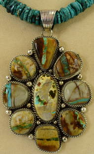 Royston Turquoise Sterling Huge Pendant - Robert Shakey: This piece is Huge - Measuring 4.25 inches from top to bottom and 2.75 inches wide. The piece has 9 Royston Ribbon Turquoise pieces accented with rope and rain drop beads. The turquoise Center