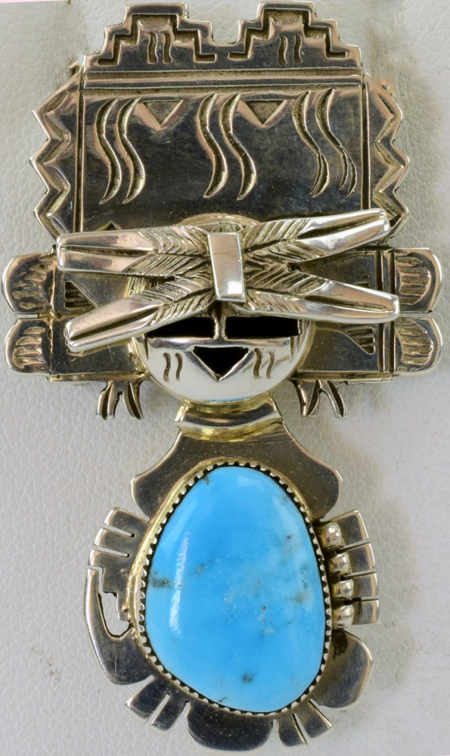 Navajo Sterling Kachina Pin/Pendant - Nelson Morgan: Measures 2 1/8 inches in length x 1.25 inches wide this is a Pendant {Hook} or Pin {has pin clip on back also}. The piece has the traditional Caricature look that this artist is know for. The center f