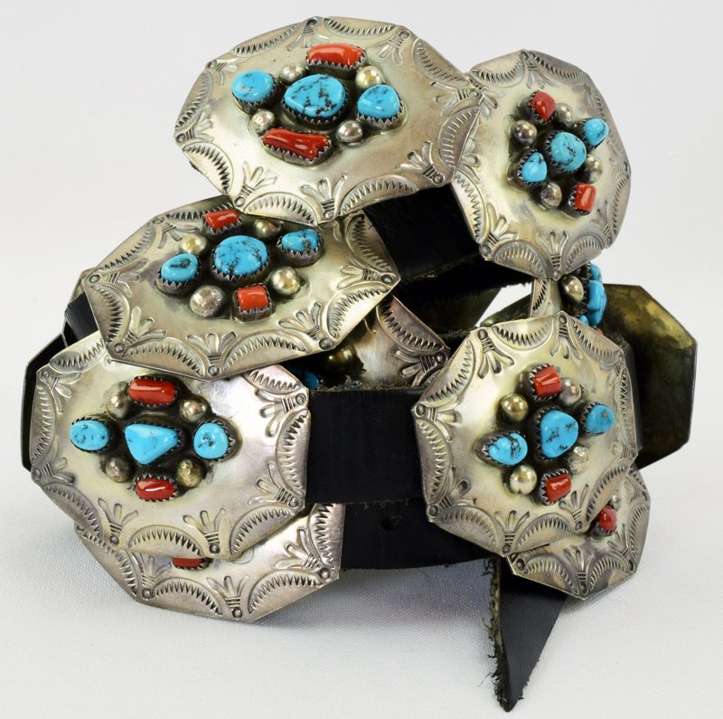 Vintage Sterling Coral and Turquoise Concho Belt: Age Circa: Vintage Native C. 1980 Markings: BJB STERLING Country of Origin: United StatesBrand: BETTY BENNETT Gram Weight: 278.6 GramsMetal Type: .925 Sterling Silver Main Stone: Kingman Turquoise Mea
