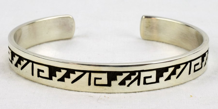 Navajo Sterling Stamped Overlay Bracelet-C. Peterson: Measures 1/8 inch all around with deep Overlay Cuttings. Inside measures 5.75 inches plus a gap of 1 inch. Marked Sterling and Signed "C.Peterson". Weighs 24.9 Grams. Native American, Navajo, Southwes