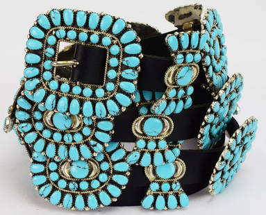 Masterpiece Concho Belt by Juliana Williams: Measures 54 inches from the end of the Buckle to the tip end of the leather. this belt has a Buckle that Measures 2.50 inches wide x 2.25 inches Tall. It has 35 Turquoise {Block} Stone in the Buckle.