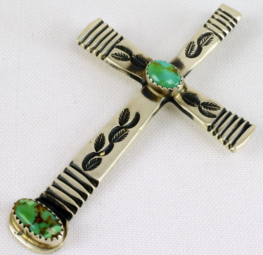 Navajo Sterling Stamped Cross Pendant with Turquoise: Measures 3 inches x 1.75 inches wide. This piece has deep stamp design work with a Natural Turquoise Stone in the center and at the bottom. The pendant has a Shepherds hook on the back for beads or ch